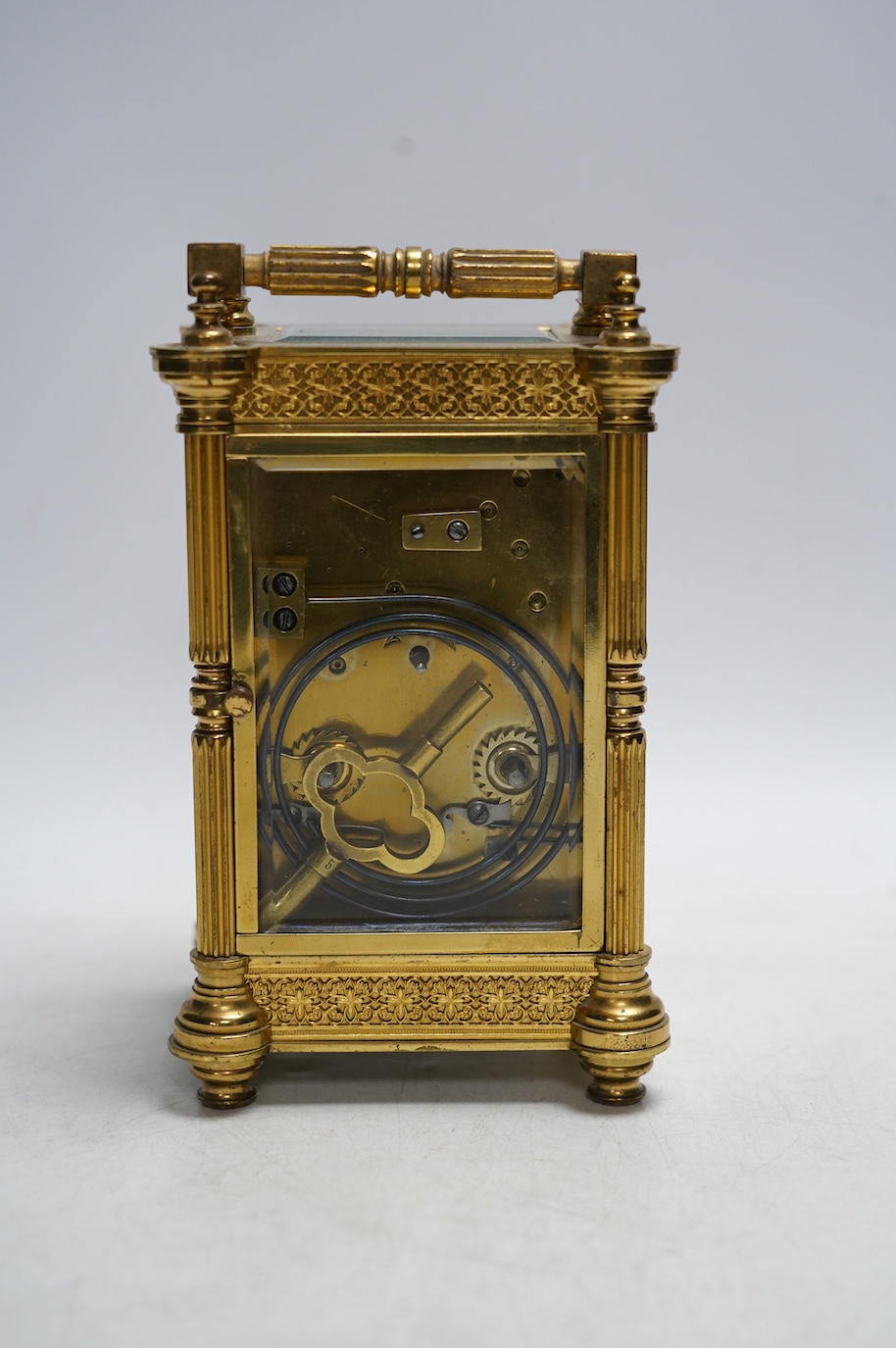 A late 19th French pierced brass cased eight day carriage timepiece, with key, 17cm. Condition - side panel cracked, not tested as working